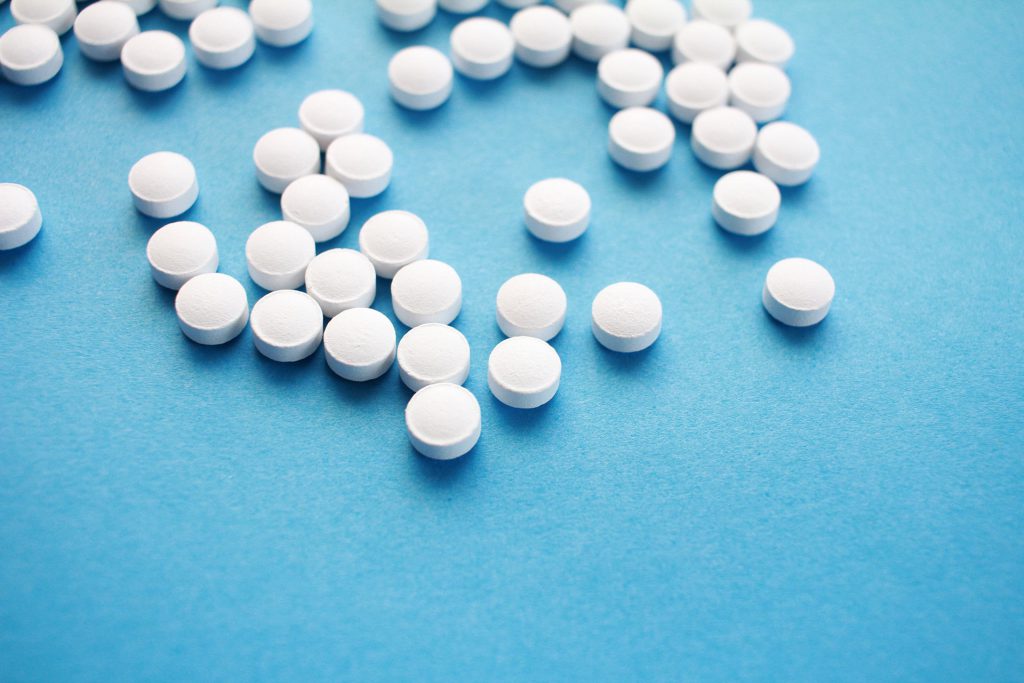 Pills on Light Blue Background