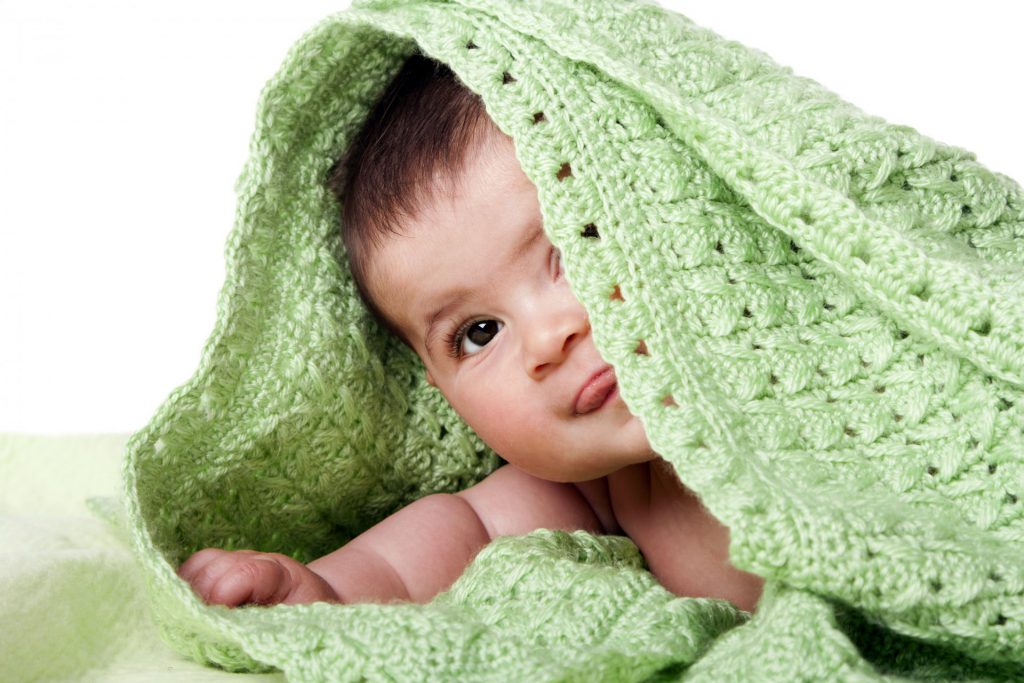 Baby Under Green Blanket