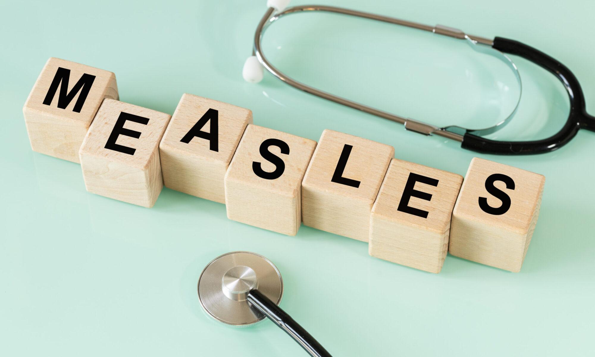 Wood letter cubes spelling measles